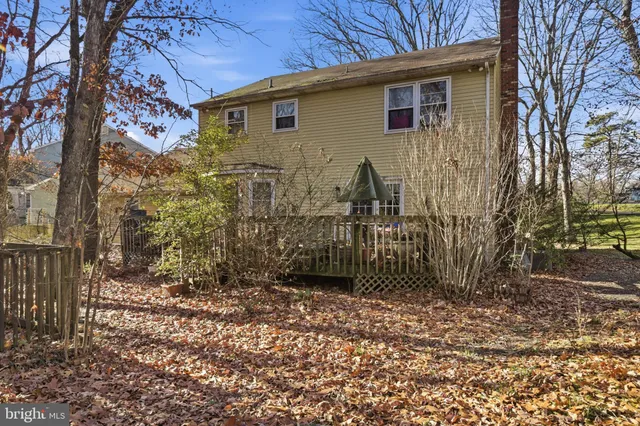 a view of a backyard of the house