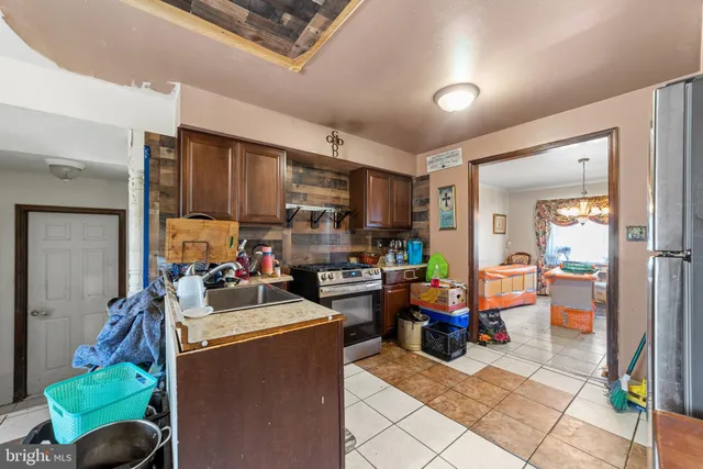 a living room filled with furniture and a window