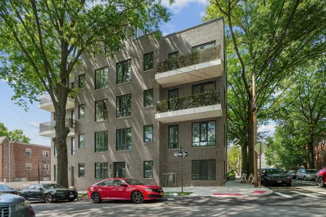 a view of a hallway with granite countertop a washer and dryer