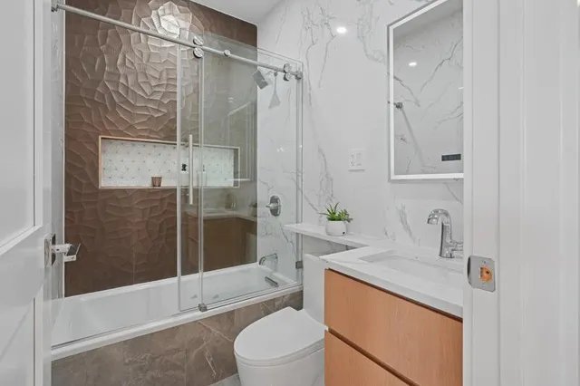 a large white kitchen with a large window