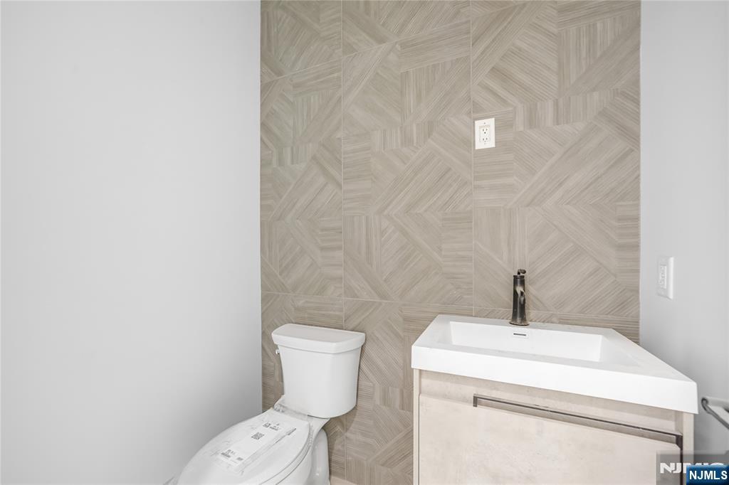 762 Williams Place, Unit A Cliffside Park, NJ 07010 - Photo 16 of 30 a white toilet sitting next to a white sink