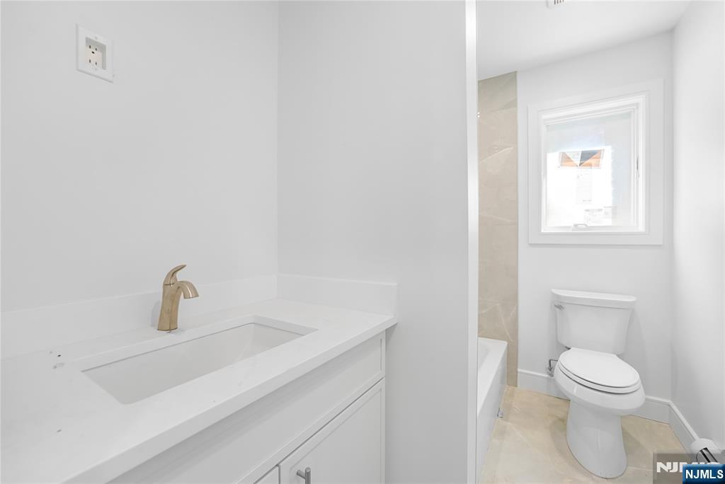762 Williams Place, Unit A Cliffside Park, NJ 07010 - Photo 20 of 30 a bathroom with a sink and a toilet