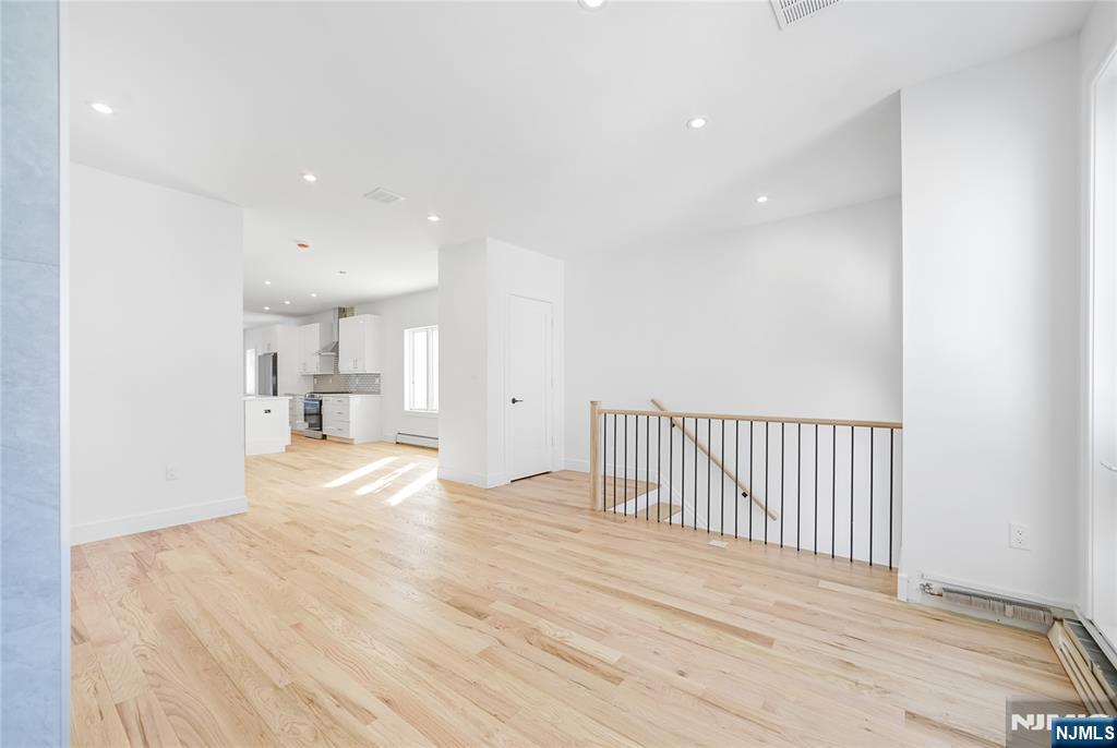 762 Williams Place, Unit A Cliffside Park, NJ 07010 - Photo 7 of 30 a view of empty room with wooden floor