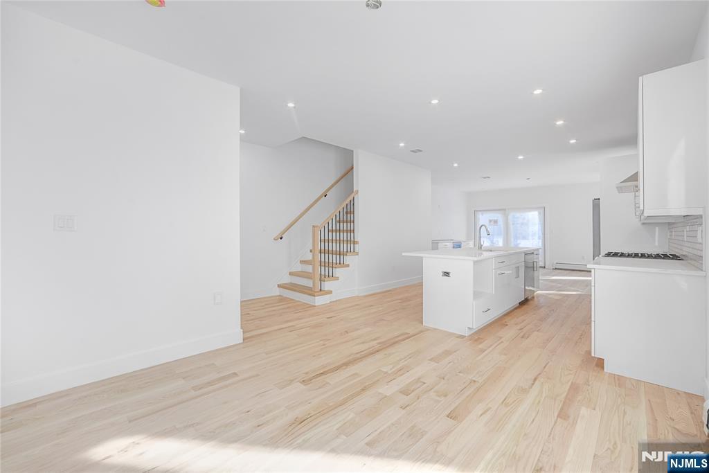 762 Williams Place, Unit A Cliffside Park, NJ 07010 - Photo 10 of 30 a view of kitchen with wooden floor and electronic appliances