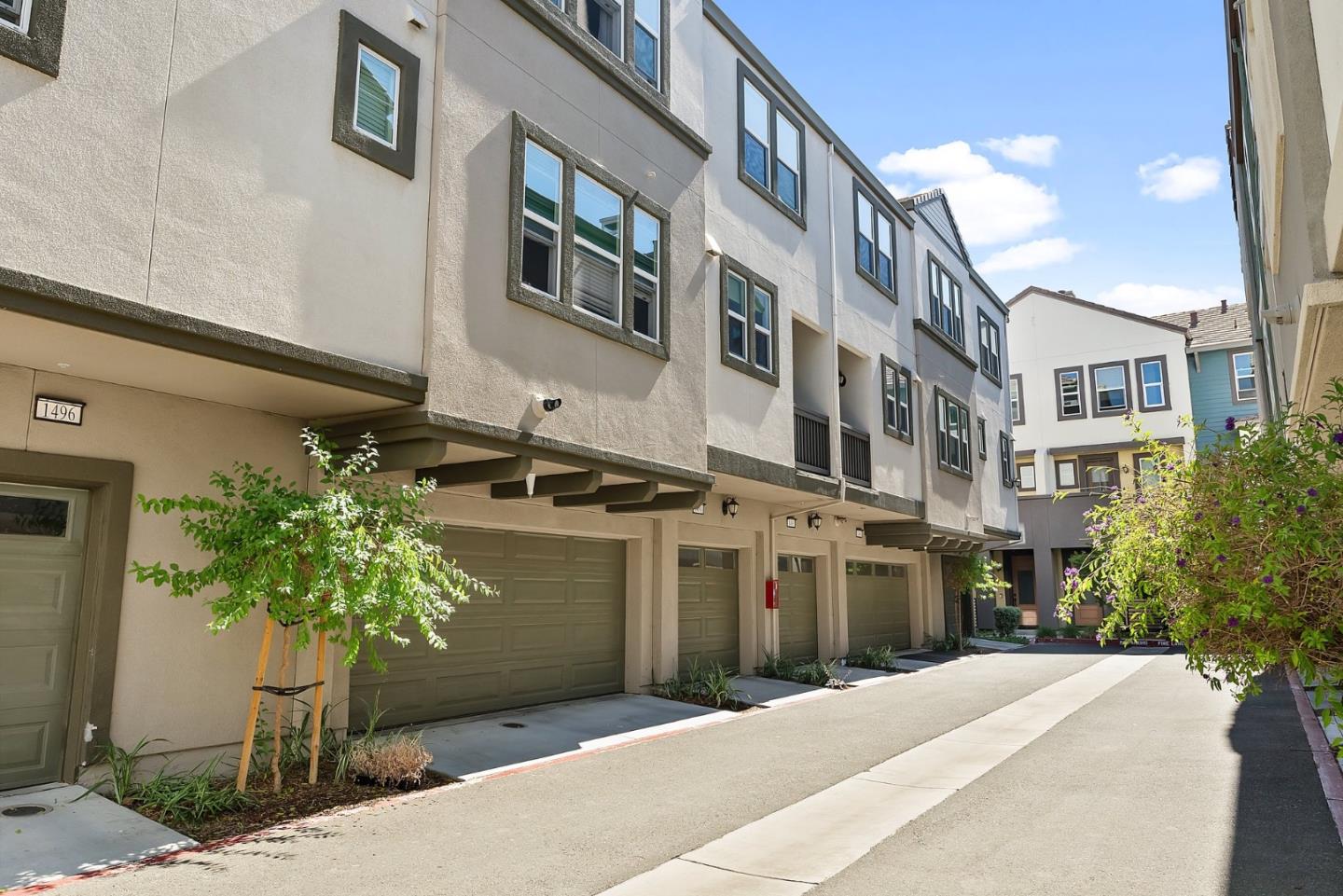 1488 Cherry Circle Milpitas, CA 95035 - Photo 19 of 20 a front view of a building with a yard