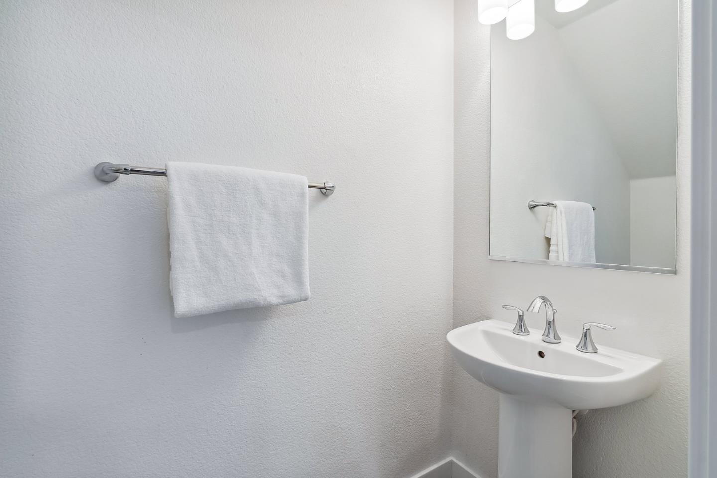1488 Cherry Circle Milpitas, CA 95035 - Photo 6 of 20 a bathroom with a sink a mirror and shower curtain