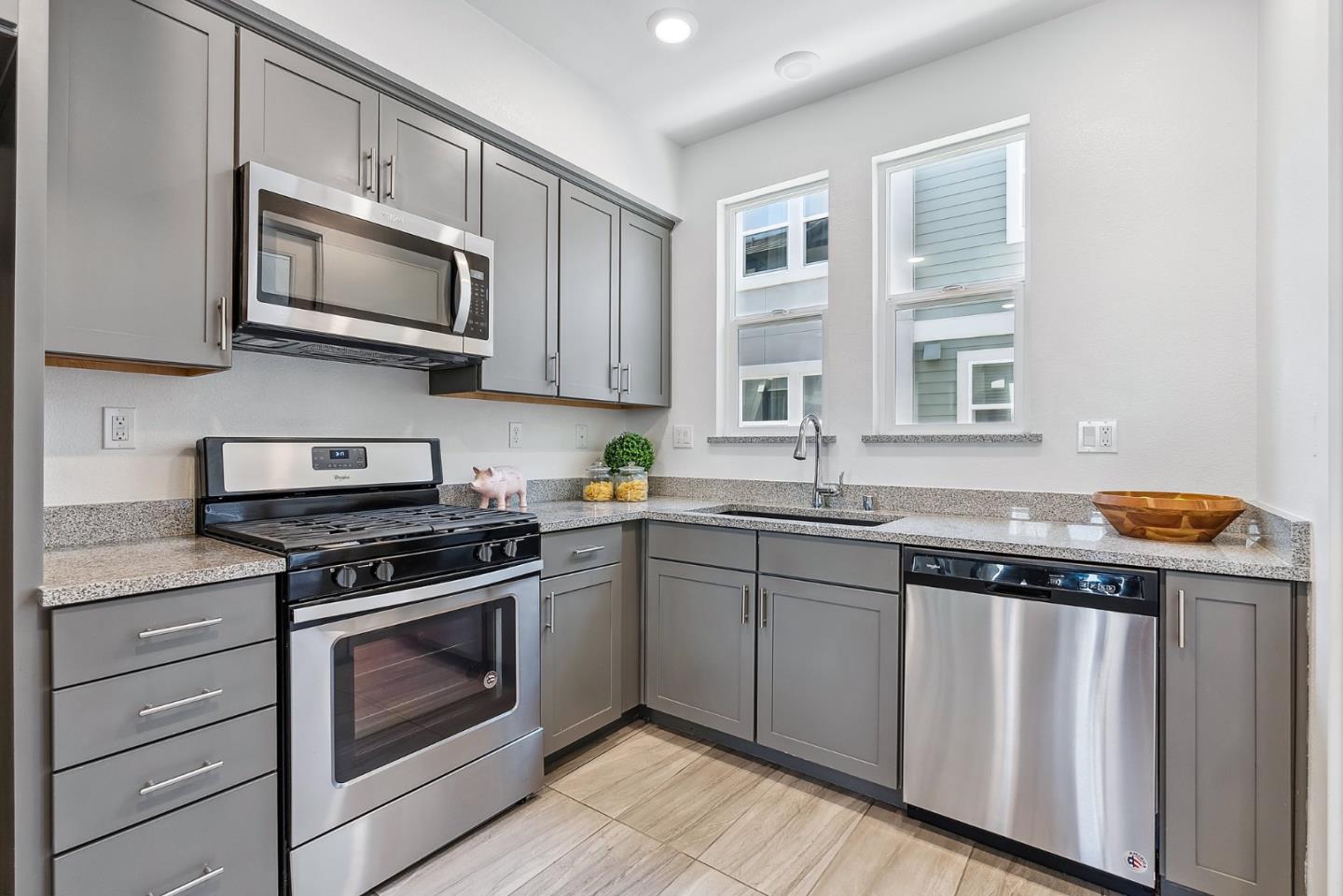 1488 Cherry Circle Milpitas, CA 95035 - Photo 8 of 20 a kitchen with stainless steel appliances granite countertop a stove and a microwave