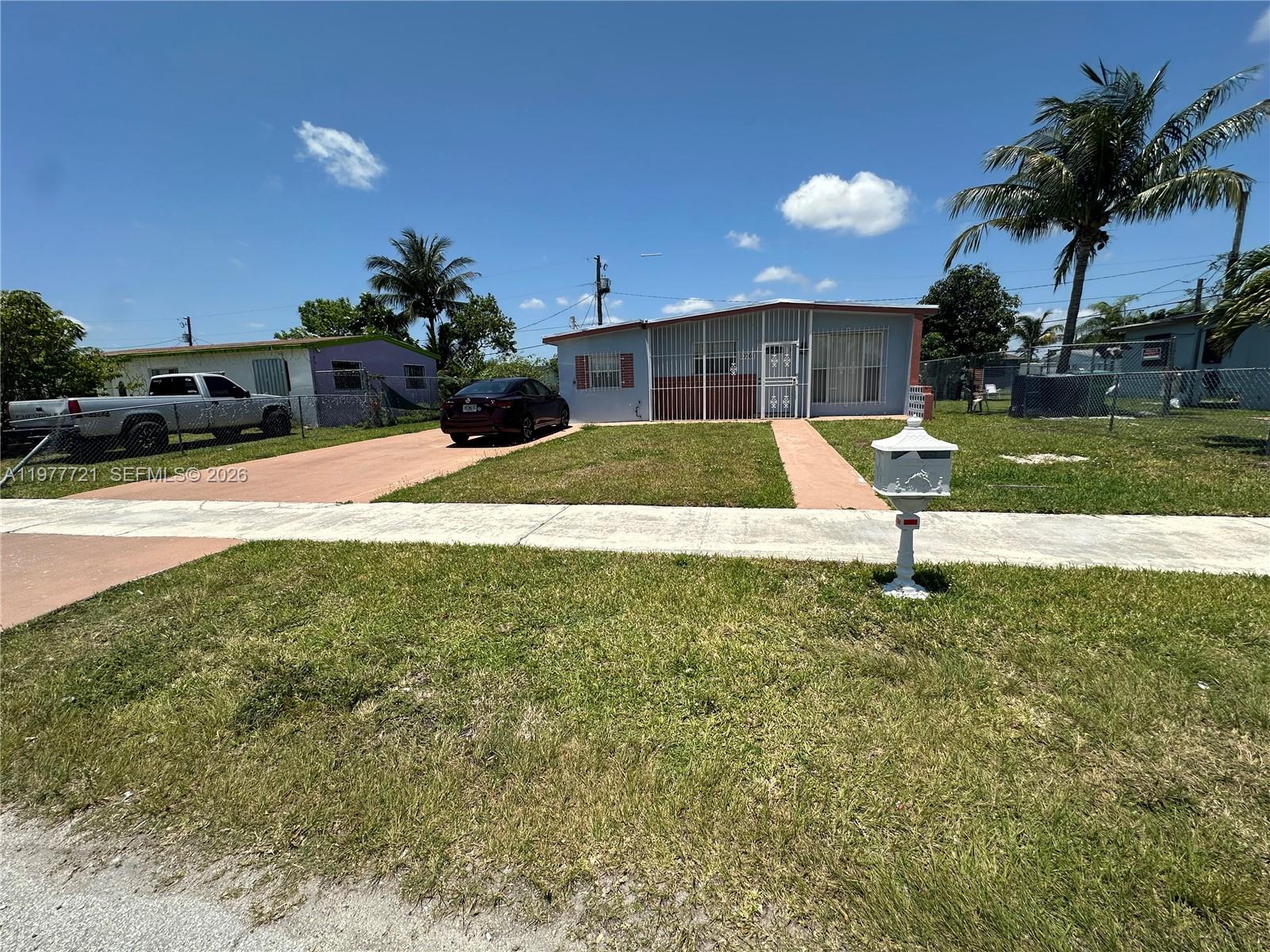 10761 Southwest 221st Street Miami, FL 33170 - Photo 2 of 32 a view of a backyard