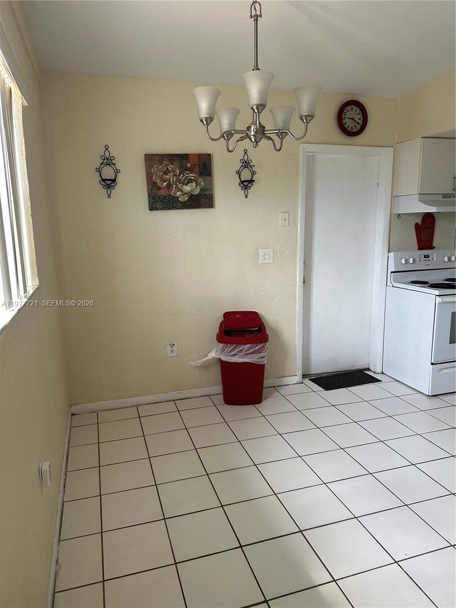 10761 Southwest 221st Street Miami, FL 33170 - Photo 29 of 32 a view of an empty room and window