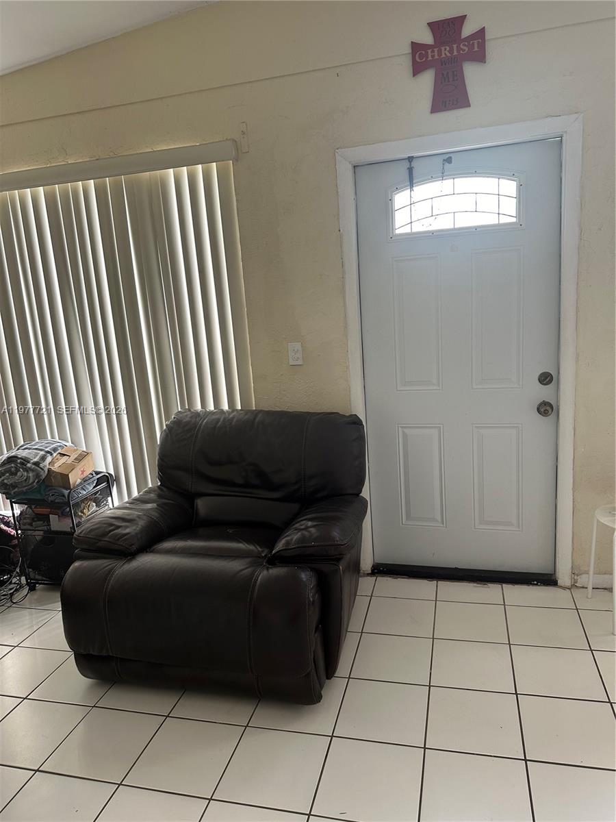 10761 Southwest 221st Street Miami, FL 33170 - Photo 30 of 32 a living room with furniture and a window