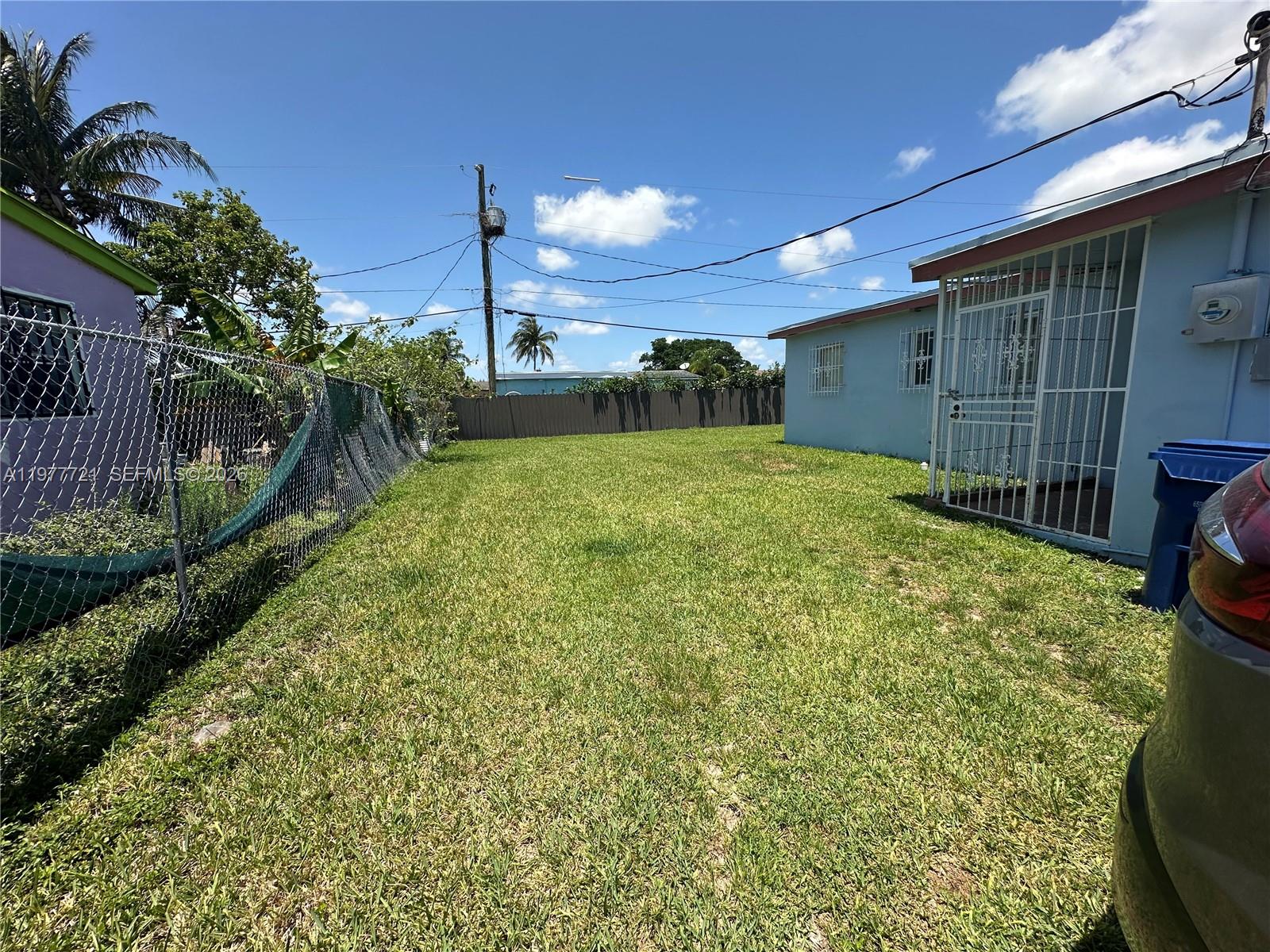 10761 Southwest 221st Street Miami, FL 33170 - Photo 3 of 32 a view of a backyard of the house