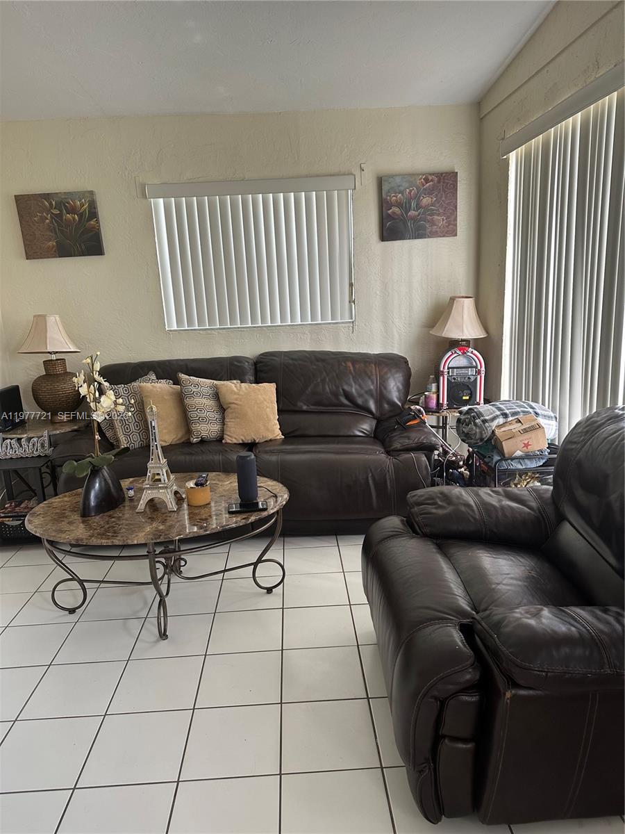 10761 Southwest 221st Street Miami, FL 33170 - Photo 7 of 32 a living room with furniture
