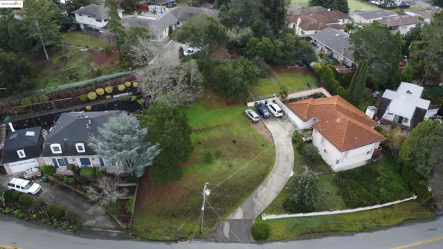 an aerial view of a house with outdoor space and street view