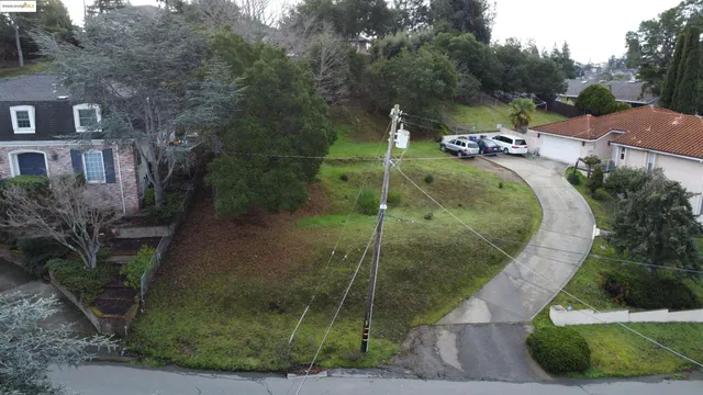 an aerial view of a house with outdoor space