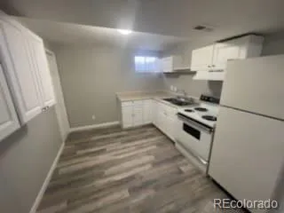 a view of an empty room with stairs and ventilation