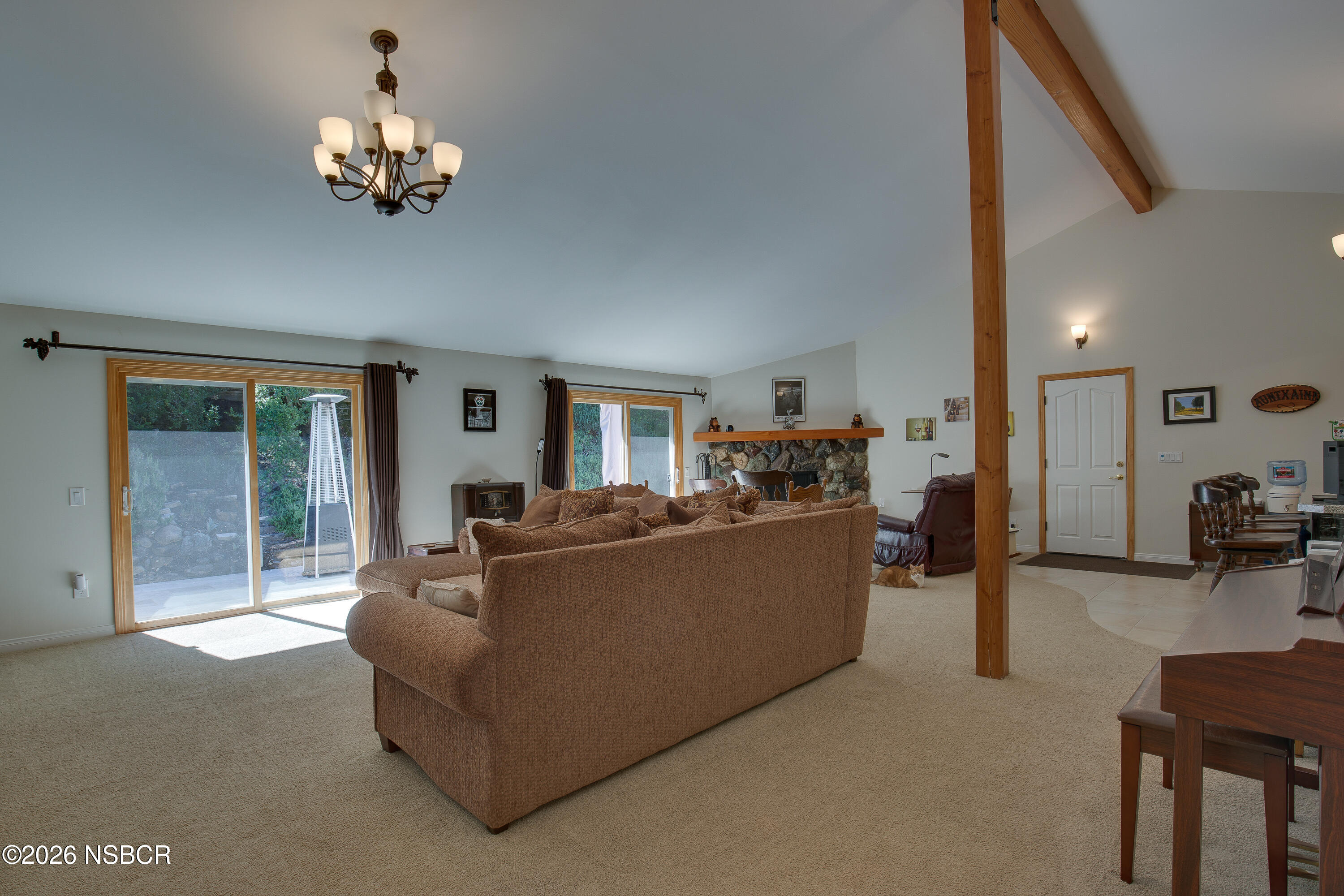 850 Fredensborg Canyon Road Solvang, CA 93463 - Photo 3 of 26 a living room with furniture and a chandelier