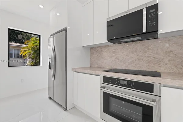 a kitchen with a stove and a microwave