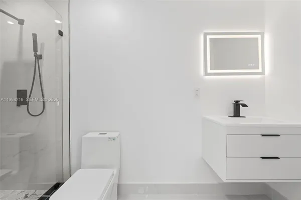 a bathroom with a toilet and a sink