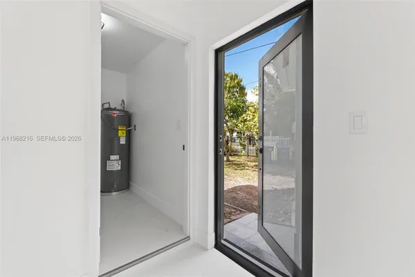 a view of a glass door and a window