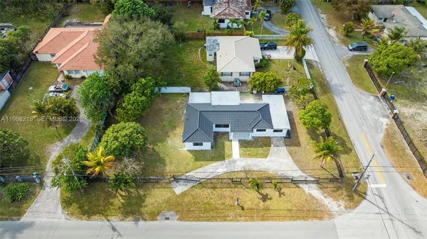 an aerial view of a house with swimming pool