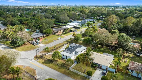 an aerial view of residential houses with outdoor space