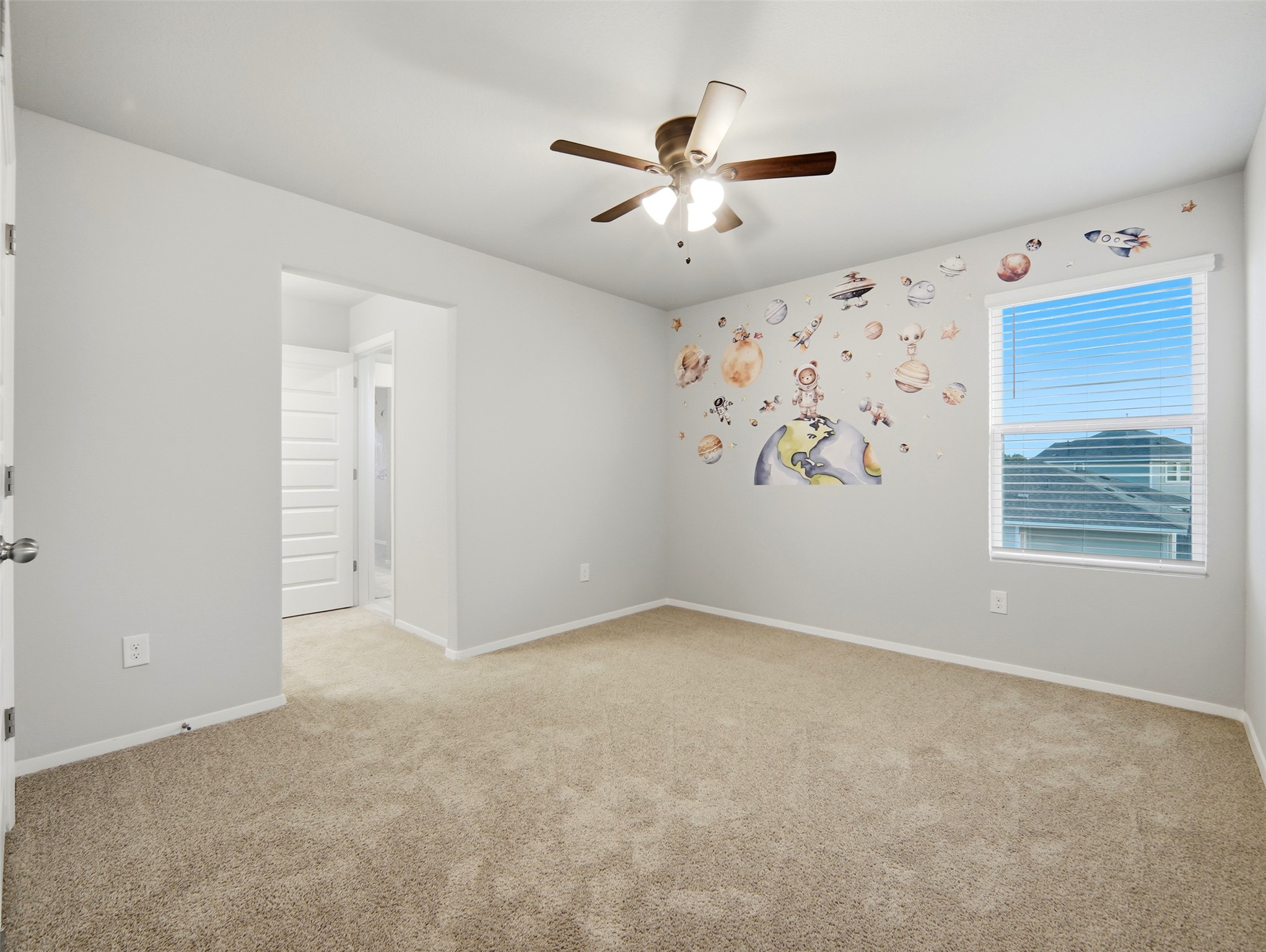 60 Bent Trl Lane Georgetown, TX 78628 - Photo 18 of 40 A well-lit bedroom features plush carpeting and a large window for abundant natural illumination.