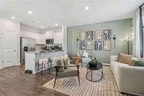 a living room with furniture and white walls