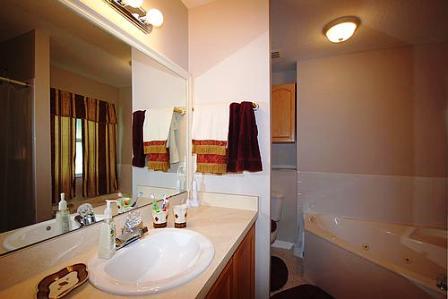 632 Queen Road St. Augustine, FL 32086 - Photo 8 of 13 a bathroom with a sink and a mirror