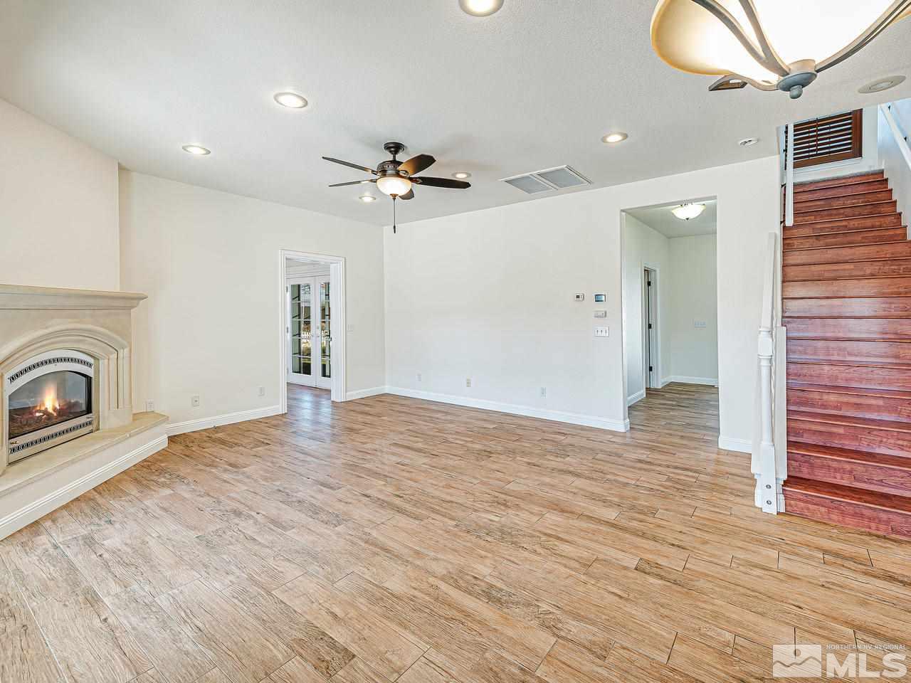 2790 Ramona Road Reno, NV 89521 - Photo 15 of 36 a view of empty room with wooden floor and fan