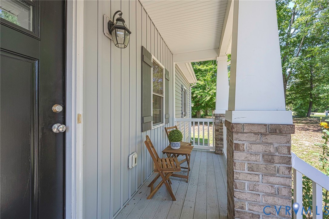 1297 Manfield Road Aylett, VA 23009 - Photo 13 of 41 a view of balcony with furniture and garden