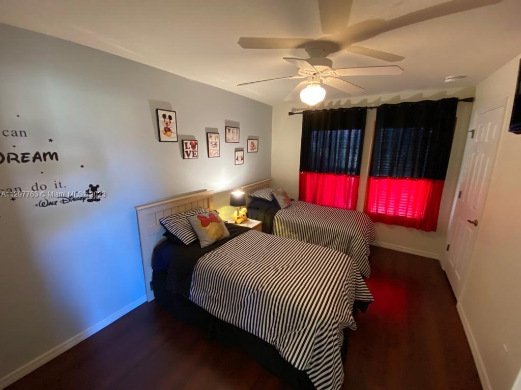 8570 Bay Lilly Loop Kissimmee, FL 34747 - Photo 15 of 36 a bedroom with a bed and a closet
