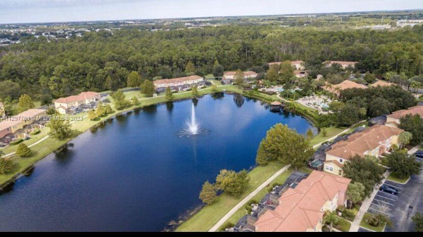 8570 Bay Lilly Loop Kissimmee, FL 34747 - Photo 29 of 36 an aerial view of a house with a lake view