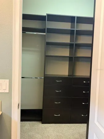 a room with a dresser and a wooden floor