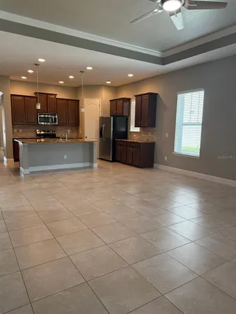 a view of kitchen with furniture and window