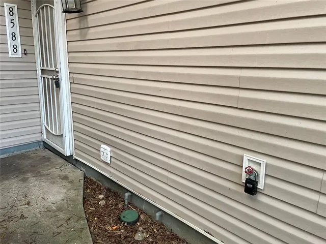 a view of gallery with wooden floor