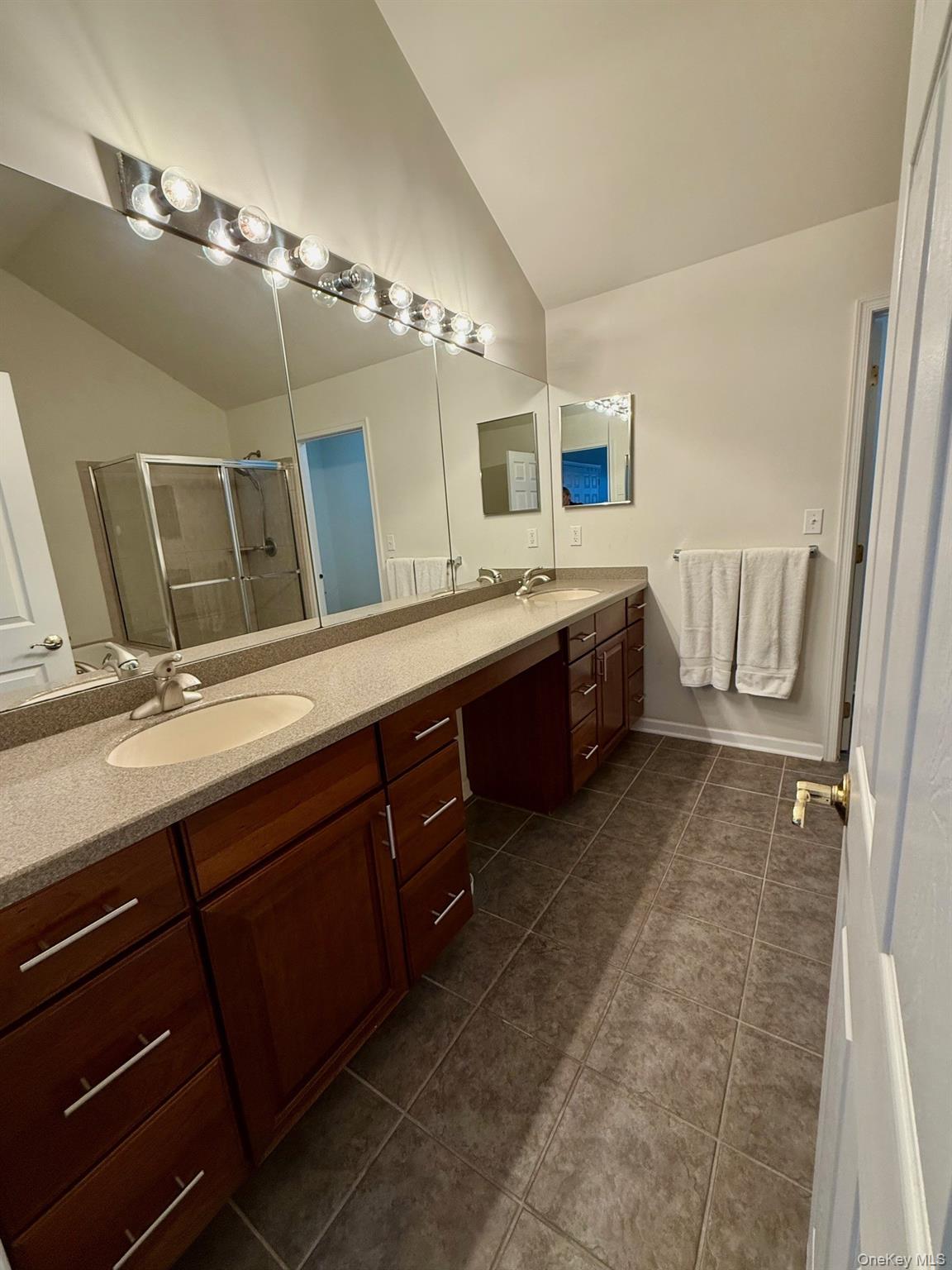 955 Huntington Drive Fishkill, NY 12524 - Photo 12 of 16 a spacious bathroom with a double vanity sink and a mirror