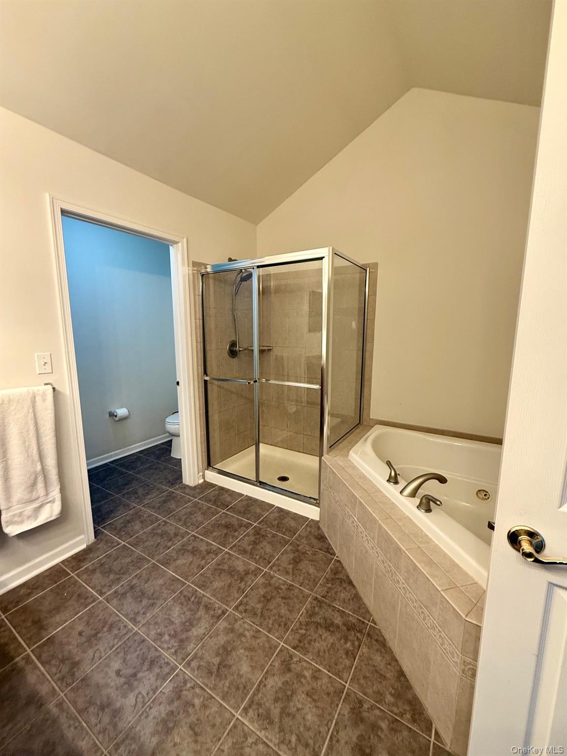 955 Huntington Drive Fishkill, NY 12524 - Photo 13 of 16 a bathroom with a tub shower and mirror