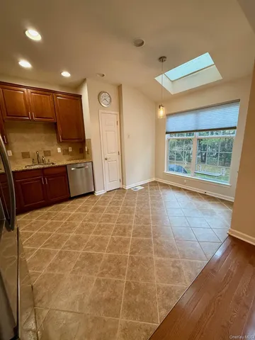 a large room with a large window and front door