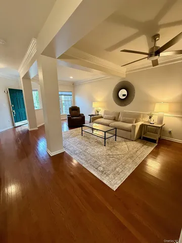 a view of a livingroom with furniture and wooden floor