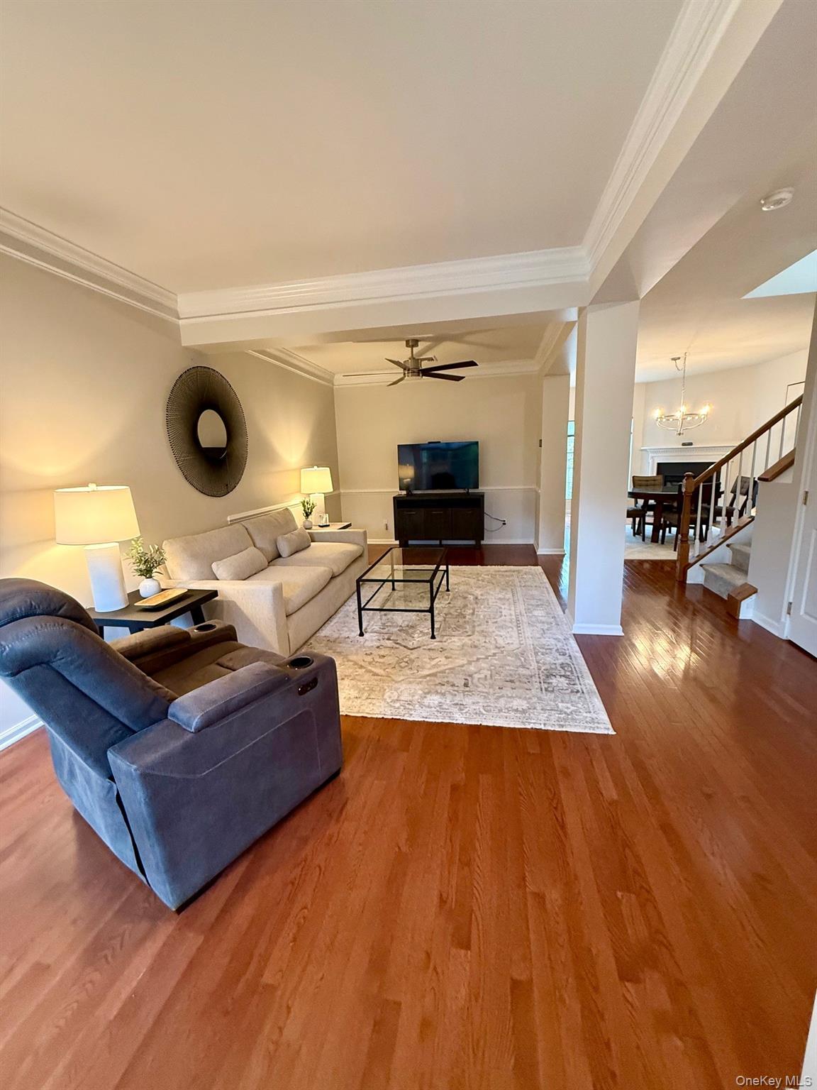 955 Huntington Drive Fishkill, NY 12524 - Photo 7 of 16 a living room with furniture and a wooden floor