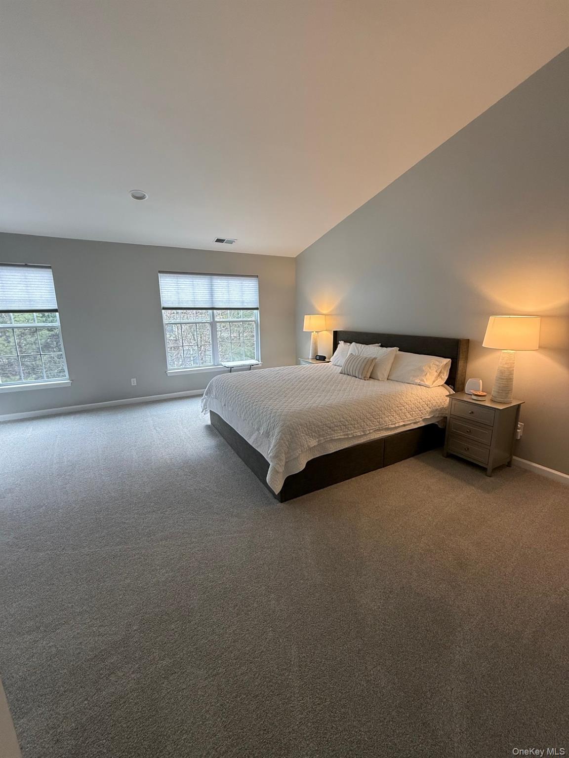 955 Huntington Drive Fishkill, NY 12524 - Photo 10 of 16 a spacious bedroom with a bed and window