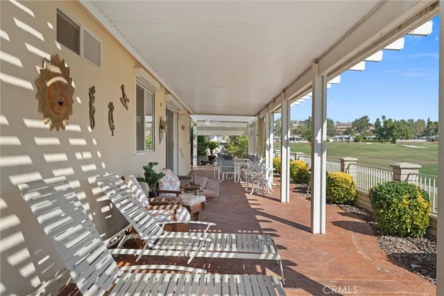 a view of a balcony with chairs and a table