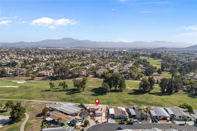 an aerial view of a town with couple of houses