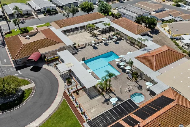 an aerial view of a house with garden space and street view