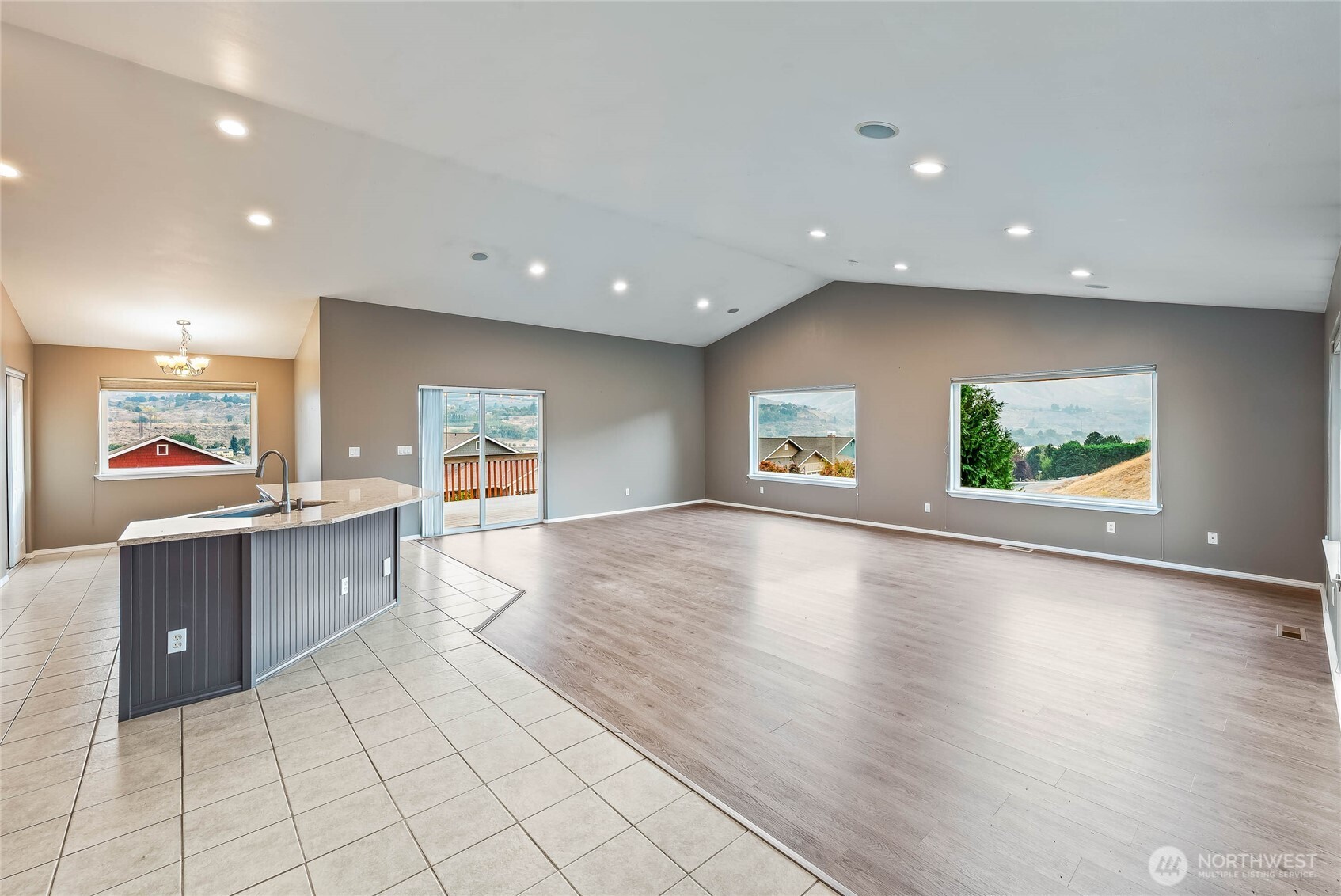 2840 Akamai Way East Wenatchee, WA 98802 - Photo 13 of 39 an open kitchen with kitchen island and wooden floors