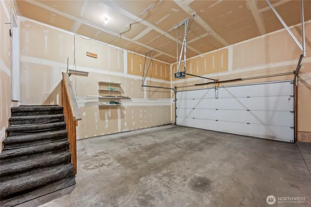 a view of an empty room with stairs