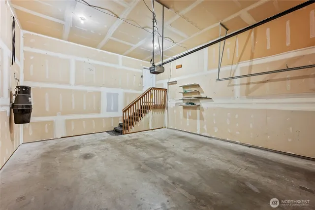 a view of an empty room with a staircase