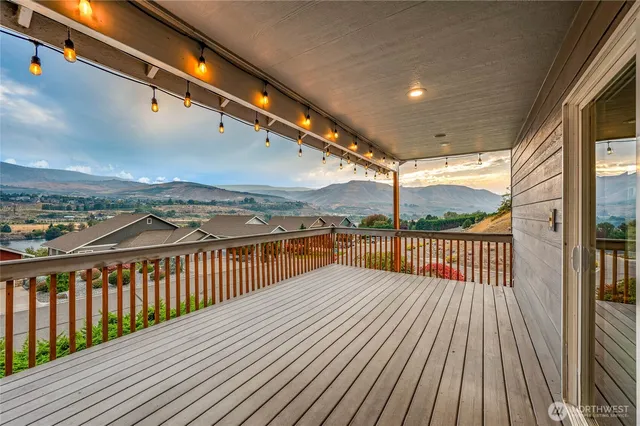 a view of balcony with wooden floor