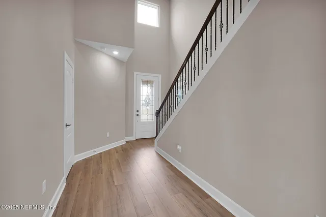 a view of entryway with wooden floor
