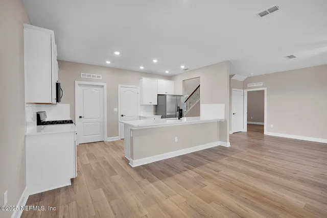 a view of kitchen with wooden floor